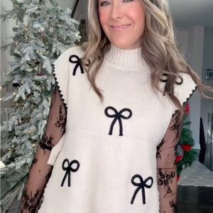 White Sweater Vest with Black Bow Accents